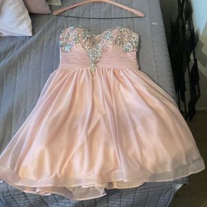 Lightly used (worn once) pink dress with crystal sequence. Size 9 in juniors.
